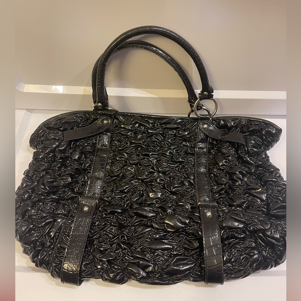 Woman’s black shiny ruffled tote handbag purse bag